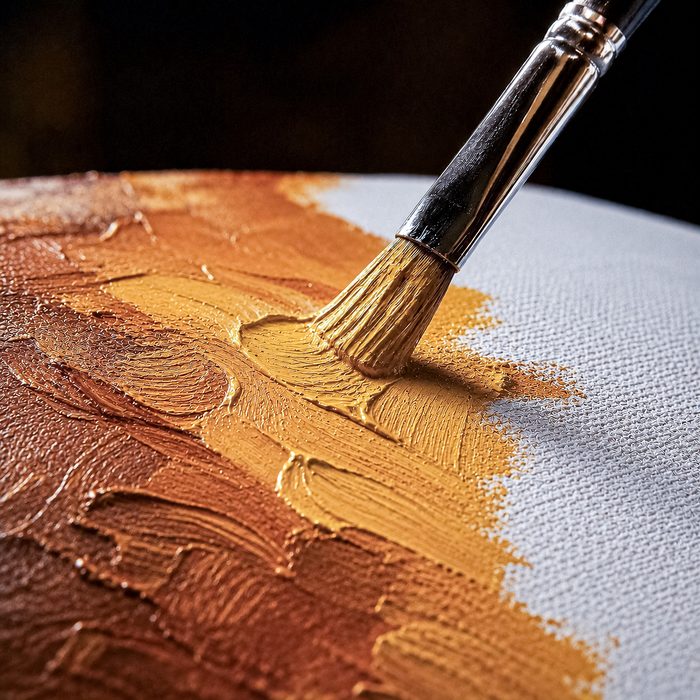 Gold pigment applied with an artist's brush on canvas